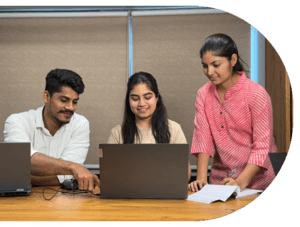 Team of software developers and QA Analysts working at the Best IT Software Development Company in India - Triveni.